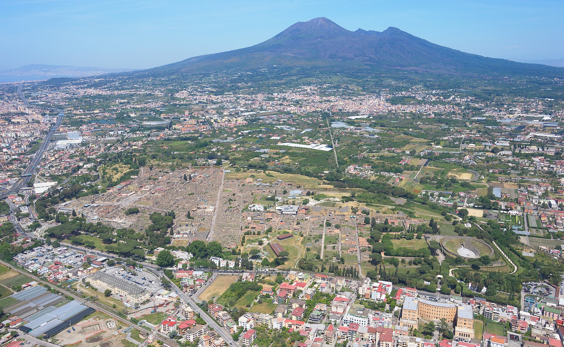 Ancient ruins of Pompeii with Mount Vesuvius in the background